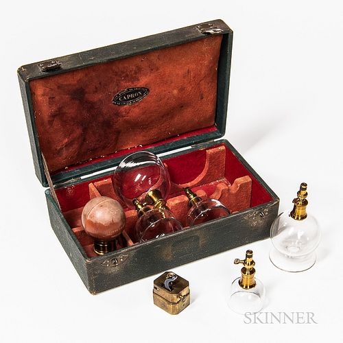 19th Century Cased Bloodletting and Cupping Set, Paris, France, leather-bound case with bail handle plate engraved "Ventouses," burgund