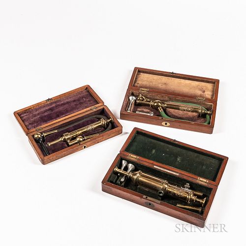 Three London Cased Enema Sets, 19th century, each in velvet-lined fitted mahogany case with lacquered brass instruments, all signed by