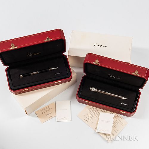 Two Limited Edition Cartier Ballpoint Watch Pens, number 1470/2000 and number 0627/2000 with rotating perpetual calendar, both with ori