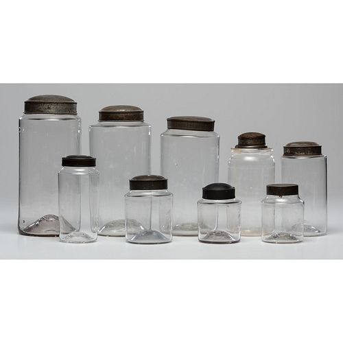 Nine Blown Glass Jars with Tin Lids