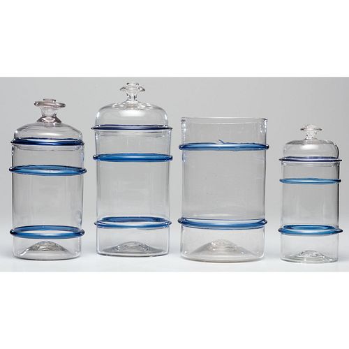 Four Blown Blue and Clear Glass Storage Jars