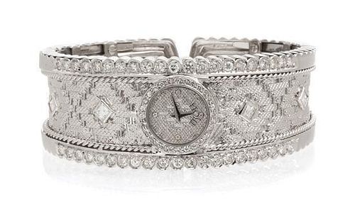 * An 18 Karat White Gold and Diamond Cuff Bracelet Wristwatch, Etoile, 52.90 dwts.