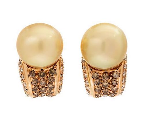 * A Pair of 18 Karat Rose Gold, Cultured Golden South Sea Pearl, Colored Diamond and Diamond Earclips, Adler, 12.20 dwts.