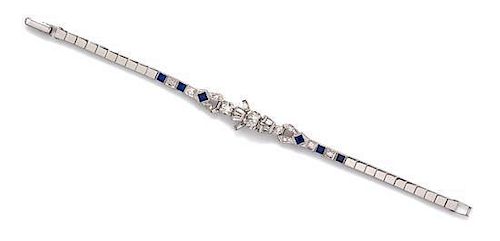 A 14 Karat White Gold, Diamond and Synthetic Sapphire Bracelet, 5.70 dwts.