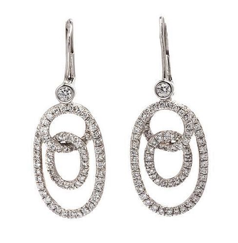 A Pair of Platinum and Diamond Earrings, 7.30 dwts.