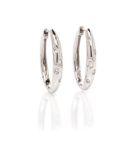 A Pair of 18 Karat White Gold and Diamond Hoop Earrings, 2.30 dwts.