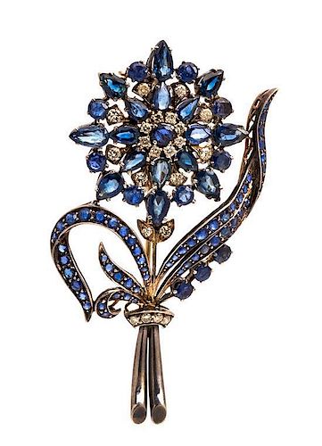 * A Yellow Gold, Diamond and Sapphire Floral Design Brooch, 20.00 dwts.