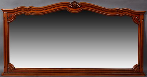 French Provincial Louis XV Style Carved Cherry Overmantle/Backbar Mirror, 20th c., the serpentine scrolled arched shell carved crest rail, over a conf