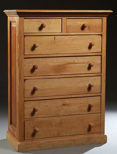 Scandinavian Tall Carved Pine Chest, late 19th c., the stepped top over two frieze drawers above five deep drawers, on a plinth base, now stripped of 