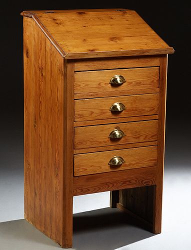 French Provincial Carved Pine Standing Desk, c. 1900, the slanted top opening to storage, over four drawers, on chamfered legs, H.- 44 1/2 in., W.- 24