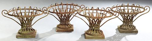 Set of Four Wrought Iron Strapwork Planters, 20th/21st c., of tapered circular form, with an arched rim and scrolled handles, on a square base, H.- 12