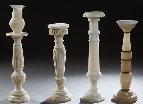 Group of Five French Carved Alabaster Pieces, early 20th c., consisting of four columns, one with an urn form lamp, Tallest- H.- 55 in., Dia.- 10 in. 