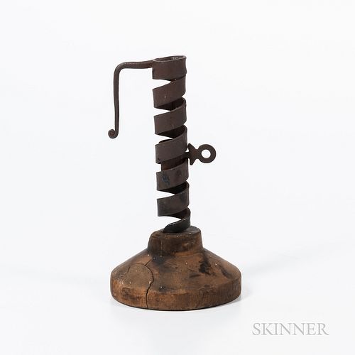 Two Wrought Iron and Turned Wood Lighting Devices, early 19th century, a spiral-adjusting candlestick and a rush light with twisted det