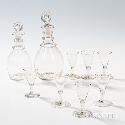 Two Blown Glass Decanters with Applied Ring Decoration and Seven Blown Wines, America, 19th century, each decanter with sunburst stoppe