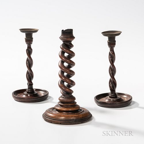 Three Wooden Barleytwist Candlesticks, England, 19th century, a single walnut stick with molded base, (top of stick burned), ht. 9; and