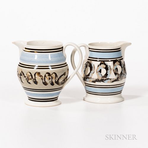 Two Slip-decorated Baluster-form Pearlware Pitchers, England, mid-19th century, with thin black bands, and central "earthworm"-decorate