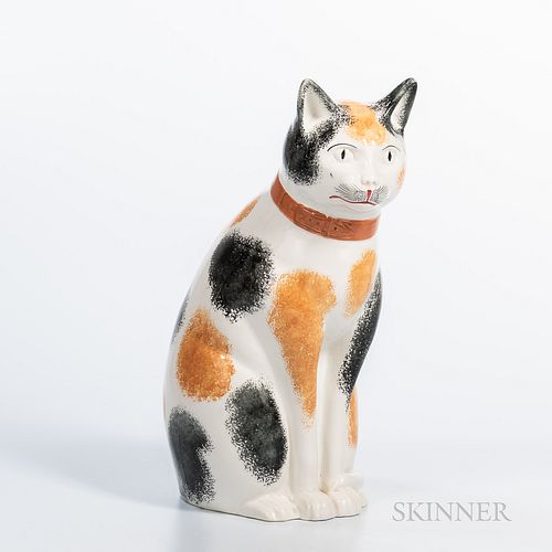 Large Glazed Staffordshire Calico Cat Figure, the seated cat with molded and painted details, ht. 13 1/4 in.Provenance: A Wellesley, Ma