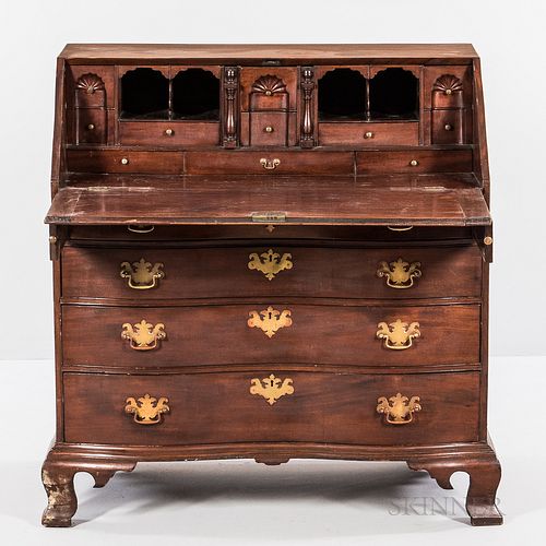 Chippendale Carved Mahogany Oxbow Serpentine Slant-lid Desk, Massachusetts. c. 1760-80, the stepped interior of fan-carved blocked draw