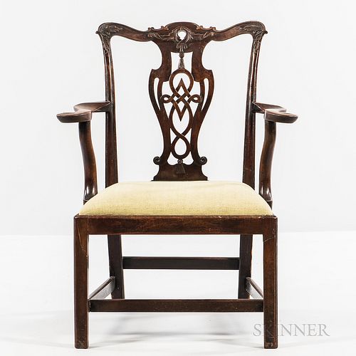 Chippendale Carved Mahogany Armchair, Massachusetts, c. 1770-80, the shaped scrolling crest rail with raised edge centering leafage, re