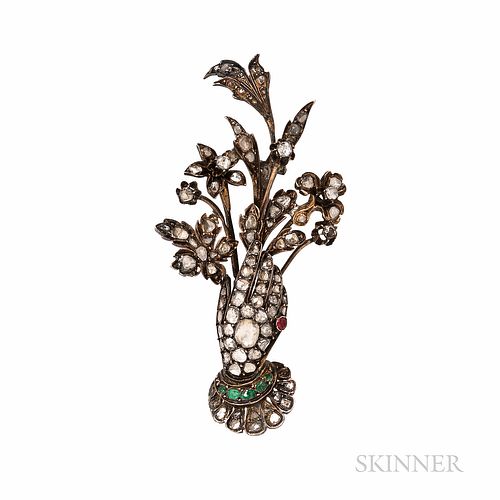 Victorian Gold and Rose-cut Diamond Brooch, designed as a gloved hand with emerald bracelet and ruby ring, holding a bouquet of flowers