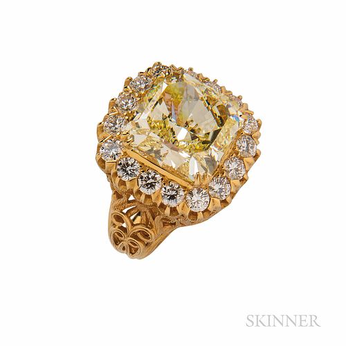 Colored Diamond Ring, Mounted by Cartier, set with a radiant-cut Fancy Yellow diamond weighing 8.92 cts., framed by full-cut diamonds,