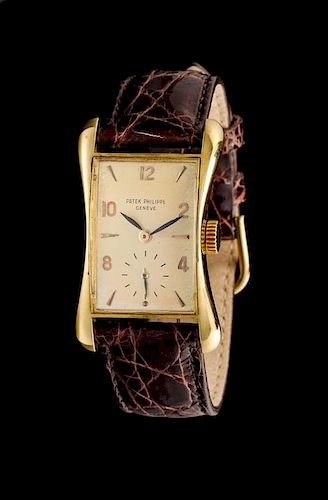 An 18 Karat Yellow Gold Ref. 2442 Wristwatch, Patek Philippe, Circa 1953,