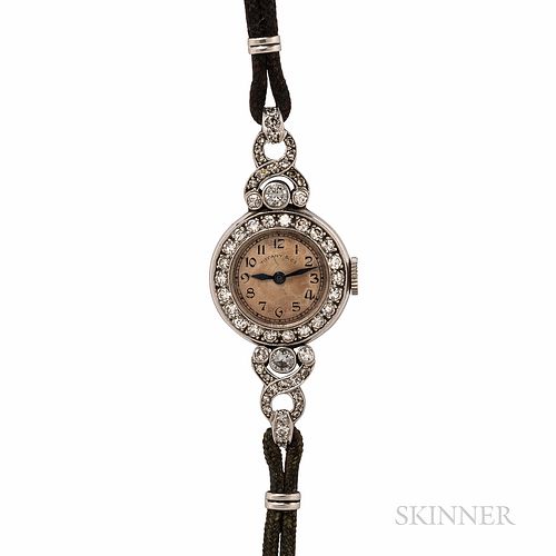 Art Deco Tiffany & Co. Platinum and Diamond Wristwatch, the silvertone dial with arabic numeral indicators, bezel and lugs bead- and be