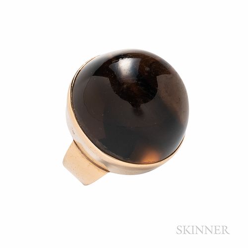 14kt Gold and Smoky Quartz Ring, set with a large cabochon measuring approx. 23.00 x 20.50 mm, 9.8 dwt, size 6 3/4, hallmarks.