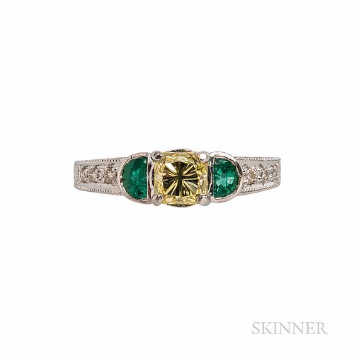Platinum, Colored Diamond, and Emerald Ring, the fancy-cut yellow diamond weighing 0.90 cts., flanked by emerald half-moons, the should