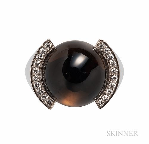 Cartier 18kt White Gold, Smoky Quartz, and Diamond Ring, set with a circular cabochon measuring approx. 16.00 mm, and full-cut diamonds