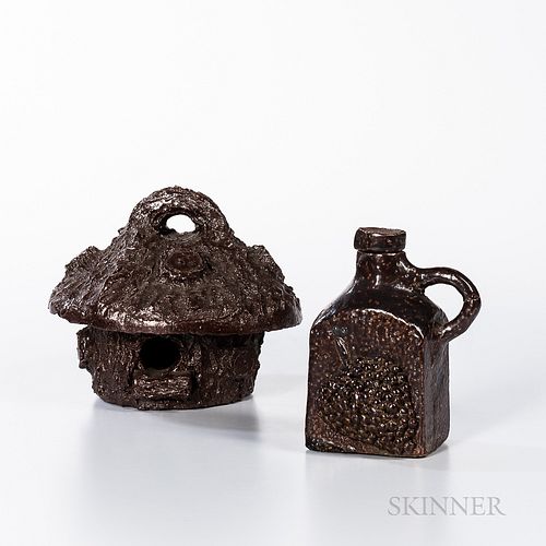 Two Sewer Tile Pottery Items, America, early 20th century, a birdhouse and a jug with grape decoration on the front, wd. to 7 1/2 in.Pr