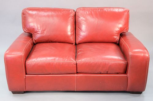 Red leather loveseat, ht. 30", wd. 67", dp. 39".