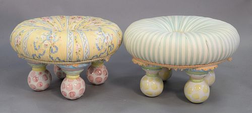 Two yellow and green Mackenzie Childs tuffet footstool ottomans with hand painted ceramic feet, ht. 13", dia. 21".