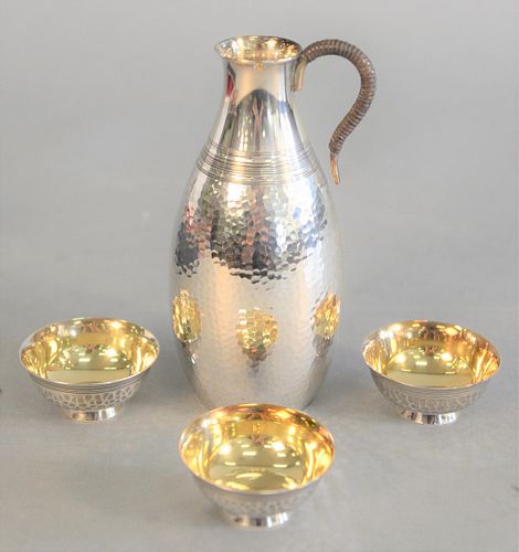 Four piece Japanese silver saki set, in fitted box, 5.4 t.oz.
