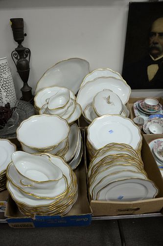 Large group of scallop-edged Limoges plates, serving platters, and gravy bowls, each stamped to the underside.