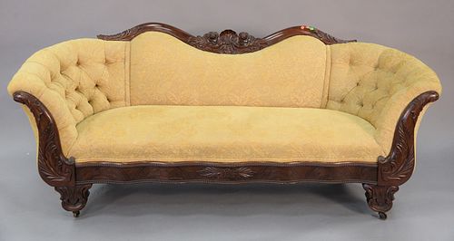 Victorian sofa having empire influenced carved mahogany frame, tufted upholstered back, ht. 28", wd. 83", dp. 23".