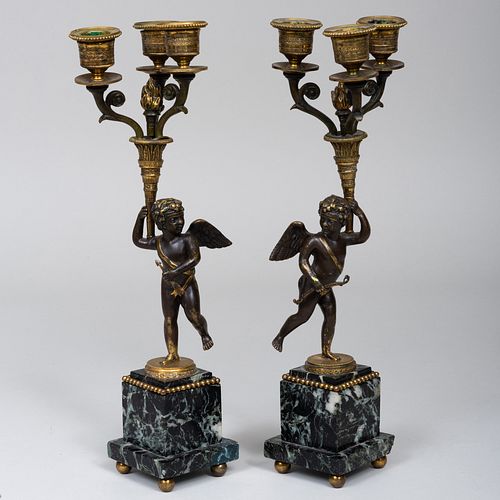 Pair of Patinated Gilt-Bronze and Verde Antico Marble Putto Form Three Light Candelabra