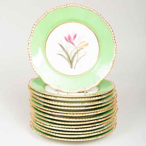 Set of Fourteen English Green Ground Porcelain Dessert Plates Decorated with Flowers