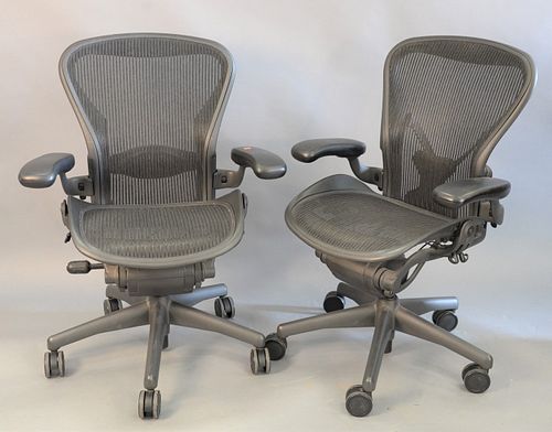 Pair of Herman Miller executive office armchairs on swivel bases, adjustable ht. 38 1/2".