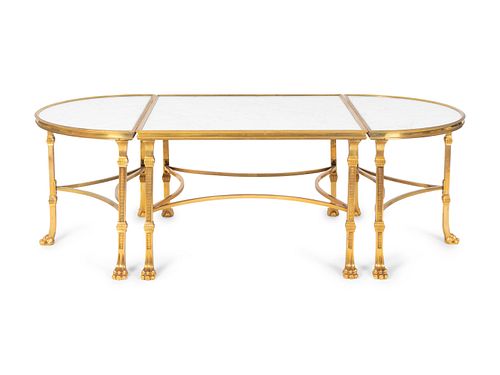 A Louis XVI Style Gilt Bronze and Marble Three Piece Cocktail Table
Height 18 x length 55 x 29 1/2 inches.