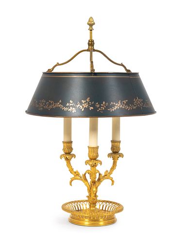 A Louis XVI Style Gilt-Bronze Bouilotte Lamp
Height 24 x diameter of shade 15 inches.