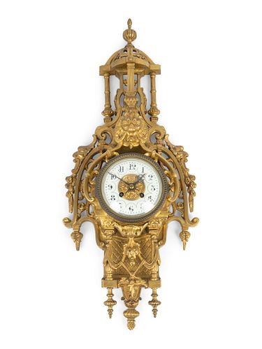 A Regence Style Gilt-Bronze Pendule Murale
Height 22 x width 8 inches.