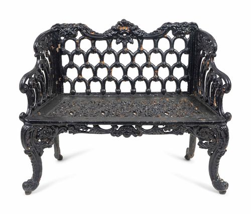 A Victorian Style Black-Painted Cast-Iron Garden Bench
Height 34 x length 42 x depth 18 inches.