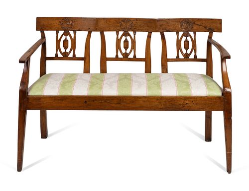 An Italian Neoclassical Style Walnut Bench
Height 33 1/2 x width 49 x depth 19 inches.