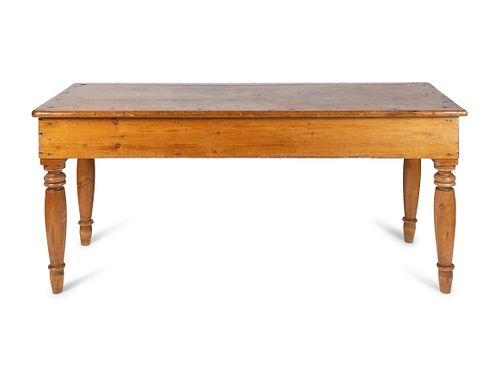 A Continental Provincial Pine Farm Table
Height 32 1/2 x width 72 x depth 27 inches.