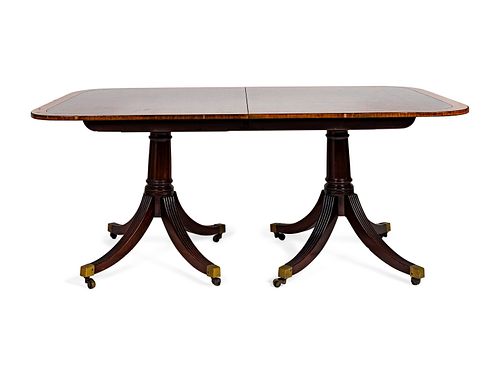 A George II Style  Crossbanded Mahogany Two-Pedestal Table
Height 29 x width 70 (without leaves) x depth 46 inches.