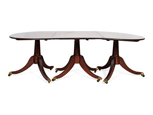 A Late George III Three Pedestal Mahogany Dining Table
Height 29 2 1/4 x length 92 1/4 x depth 41 1/2 inches.  Two leaves, 27 3/4 inches each.