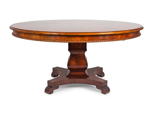 An Empire Style Figured Mahogany Pedestal Dining Table
Height 30 x diameter 65, with a 22" leaf.