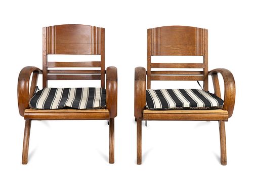 A Pair of British Colonial Teak Open Armchairs
Heigh 28 3/4 x width 24 1/2 inches.