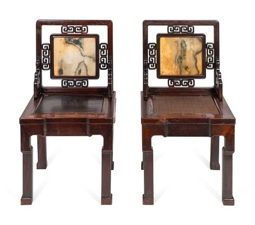 A Near Pair of Chinese Marble-Inset Hardwood Chairs
Height 36 inches.